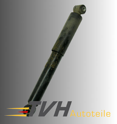 Oily defective shock absorber covered with sand and dirt